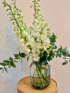 Elise bouquet by Margot Floral Design. A fresh flower bouquet composed of White Delphinium, Mini Daisy, ans Eucalyptus.