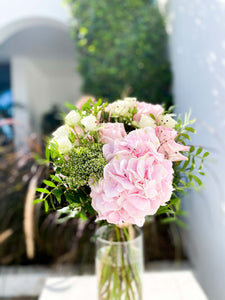 Alix bouquet by Margot Floral Design. A fresh flower bouquet composed of Pink Hydrangeas, Baby Pink O'Hara Roses, White O'Hara Roses, and Foliage. Medium size.