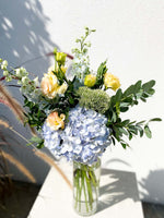 Load image into Gallery viewer, Valentine bouquet by Margot Floral Design. A fresh flower bouquet composed of Pale Yellow Roses, White Delphinium, Blue Hydrangea, and Eucalyptus. Small Size.
